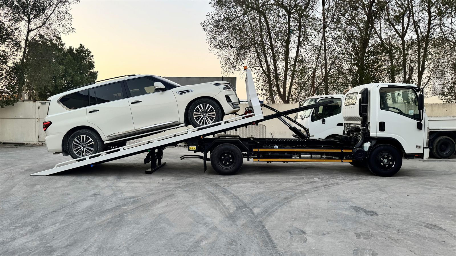 Solid Recovery flatbed recovery truck carrying a vehicle