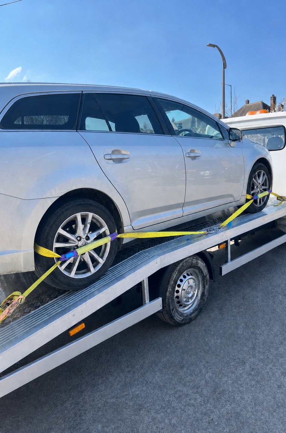 Vehicle safely strapped on the Solid Recovery flatbed truck